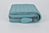 624048 Intrecciato Vitello Nappa Bifold Small Zip Around Wallet in Blue