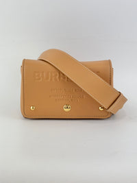 Hackberry Horseferry Debossed Leather Crossbody Bag in Warm Sand
