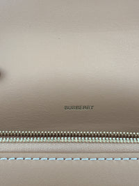 Hackberry Horseferry Debossed Leather Crossbody Bag in Warm Sand