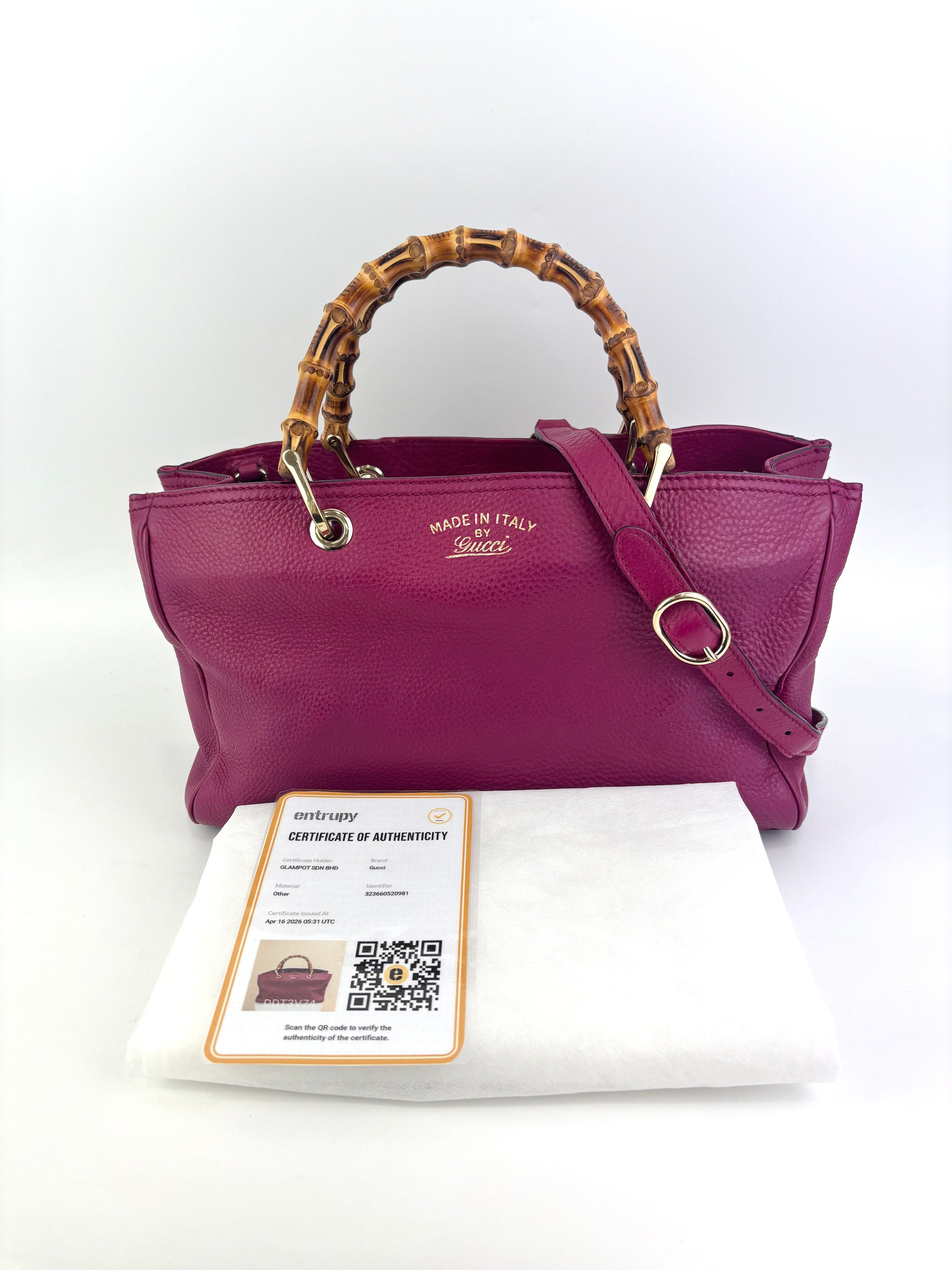 323660 紫红色皮革中号竹节手提包