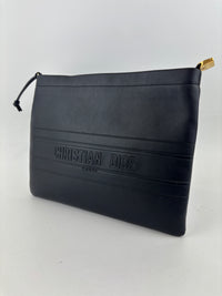 Smooth Calfskin Stripe Zip Clutch in Black
