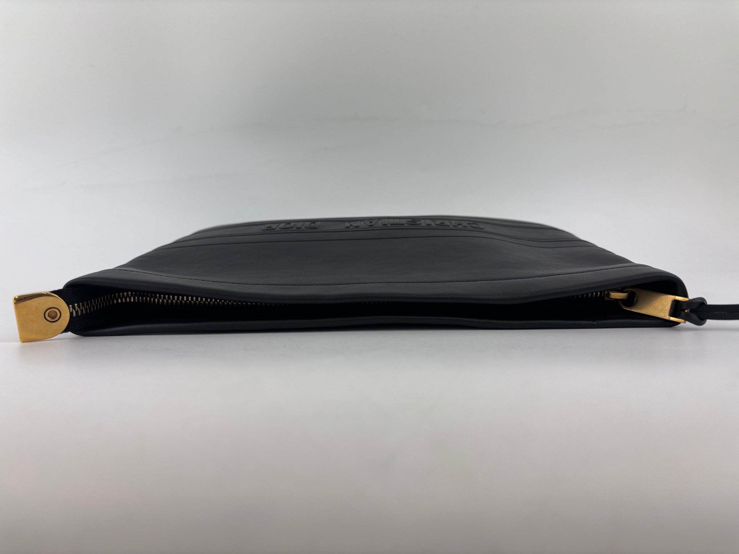 Smooth Calfskin Stripe Zip Clutch in Black