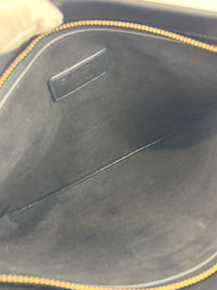 Smooth Calfskin Stripe Zip Clutch in Black