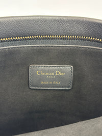 Smooth Calfskin Stripe Zip Clutch in Black