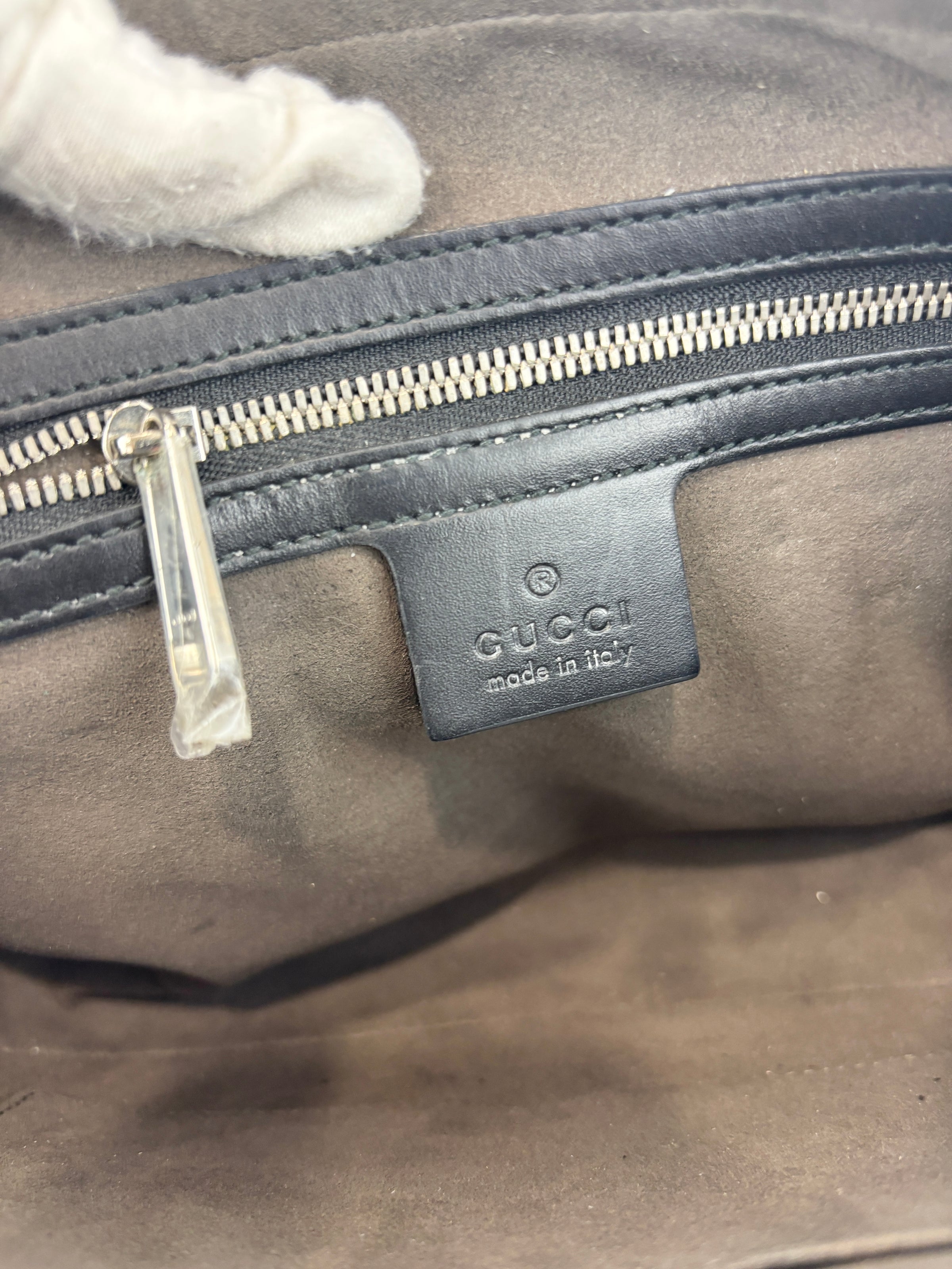 Signature Guccissima Embossed Leather Zip Clutch with Wristlet