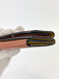 Anagram Trifold Compact Wallet in Brown Calfskin