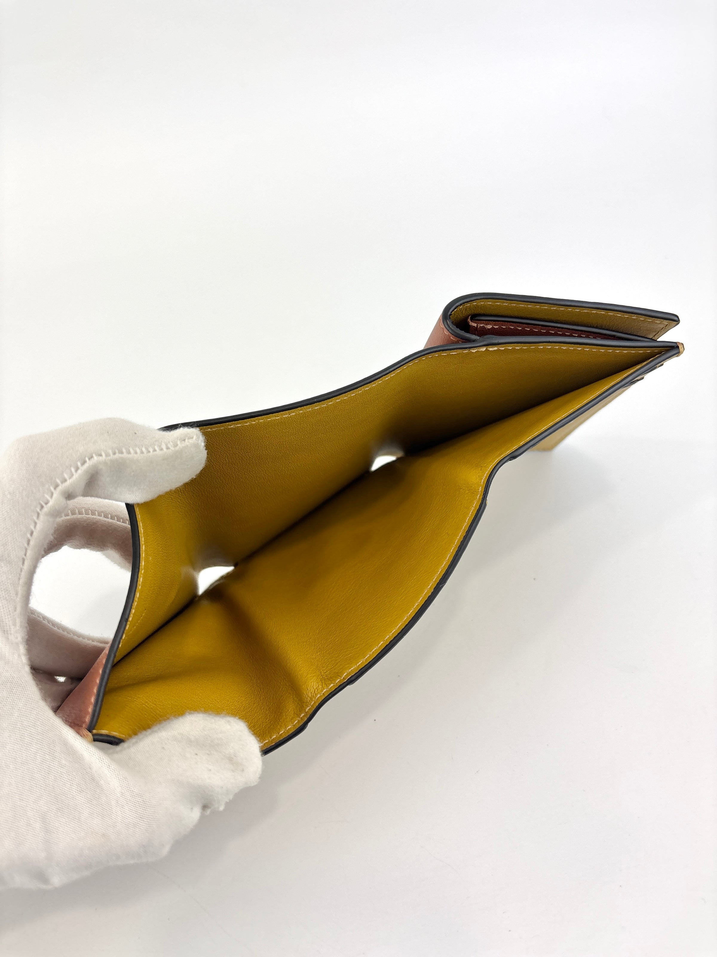 Anagram Trifold Compact Wallet in Brown Calfskin