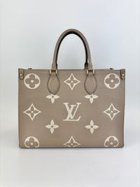 Onthego MM Bicolour Monogram Empreinte Leather Tourterelle / Crème