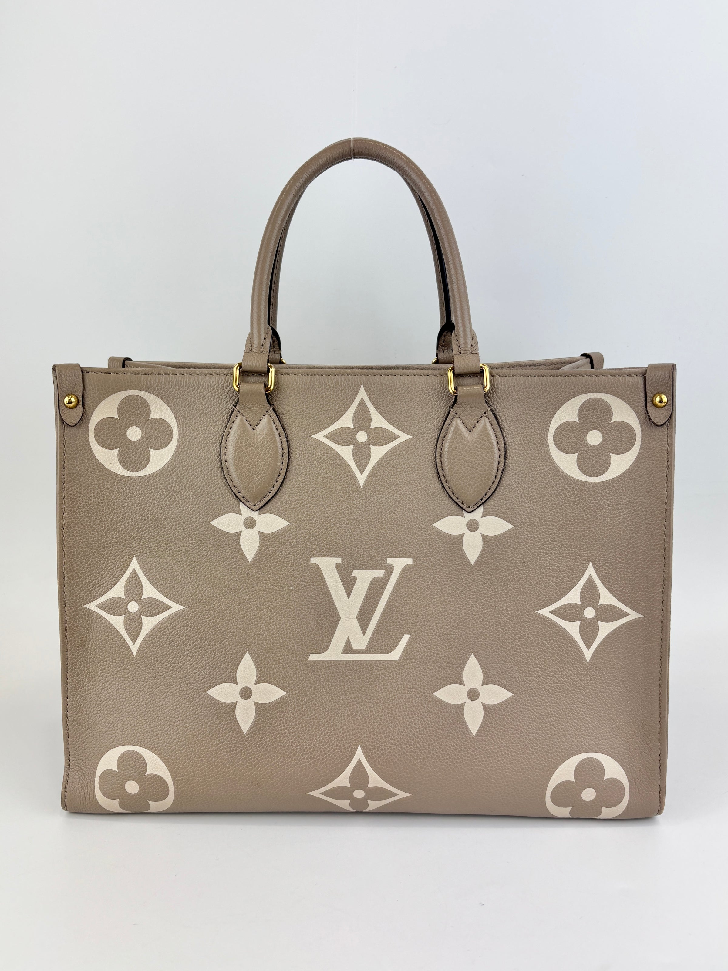 Onthego MM Bicolour Monogram Empreinte Leather Tourterelle / Crème
