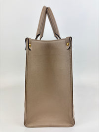 Onthego MM Bicolour Monogram Empreinte Leather Tourterelle / Crème