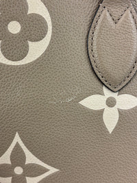 Onthego MM Bicolour Monogram Empreinte Leather Tourterelle / Crème