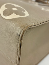 Onthego MM Bicolour Monogram Empreinte Leather Tourterelle / Crème