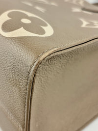 Onthego MM Bicolour Monogram Empreinte Leather Tourterelle / Crème