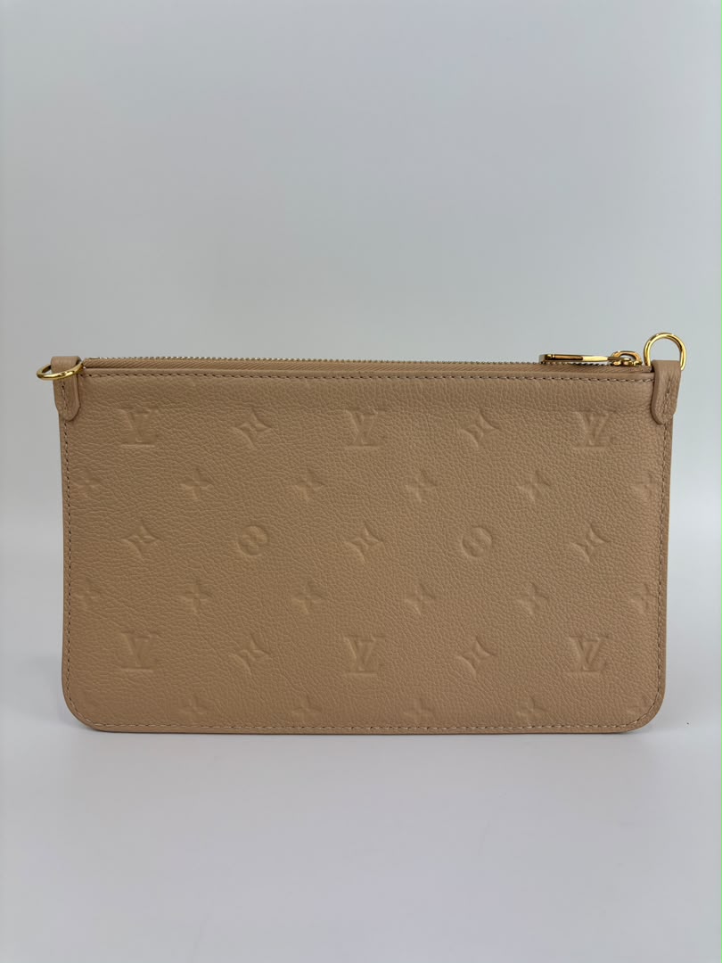 Neverfull Pouch in Monogram Empreinte Leather Crème