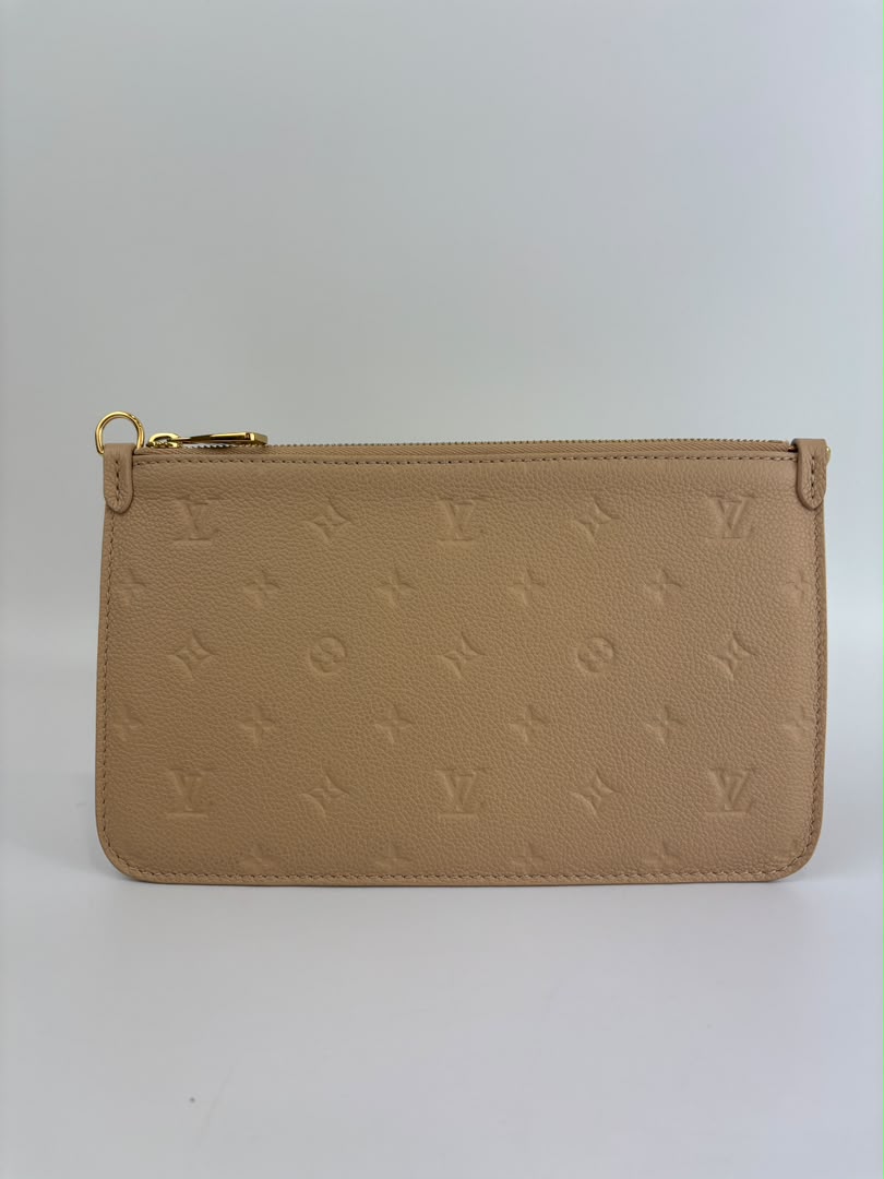 Neverfull Pouch in Monogram Empreinte Leather Crème