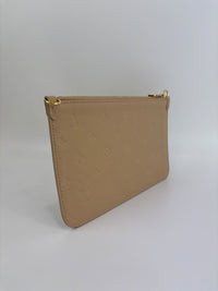 Neverfull Pouch in Monogram Empreinte Leather Crème