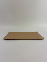 Neverfull Pouch in Monogram Empreinte Leather Crème