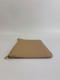 Neverfull Pouch in Monogram Empreinte Leather Crème
