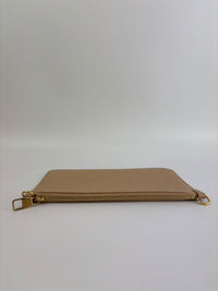 Neverfull Pouch in Monogram Empreinte Leather Crème