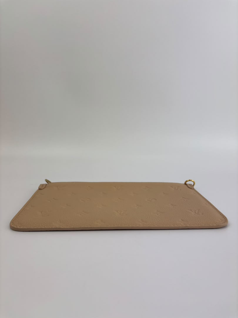 Neverfull Pouch in Monogram Empreinte Leather Crème