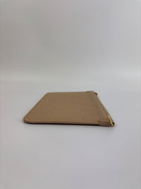 Neverfull Pouch in Monogram Empreinte Leather Crème