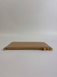 Neverfull Pouch in Monogram Empreinte Leather Crème