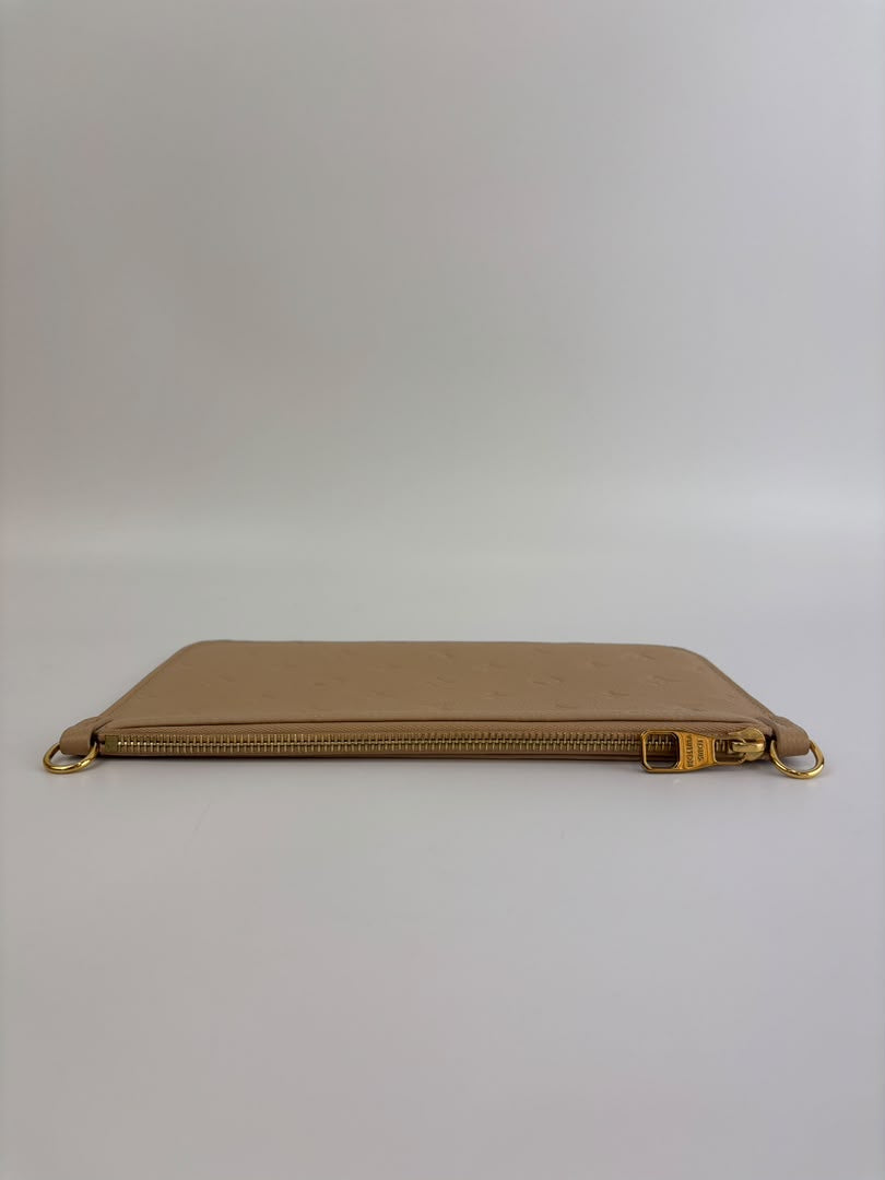 Neverfull Pouch in Monogram Empreinte Leather Crème