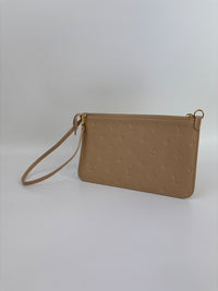 Neverfull Pouch in Monogram Empreinte Leather Crème