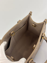 Louis Vuitton OnTheGo PM Bicolour Monogram Empreinte Tourterelle/Creme - Glampot