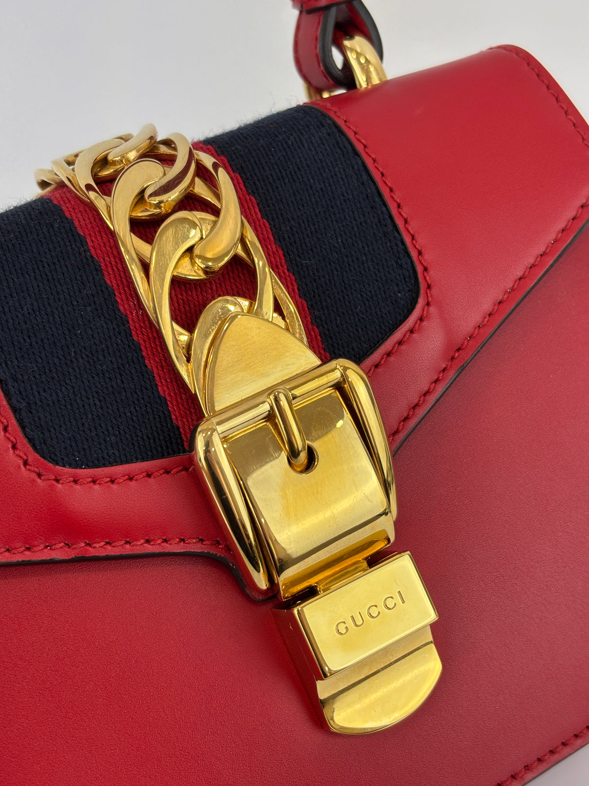 Gucci Sylvie Mini Leather Top Handle Crossbody Bag in Hibiscus Red - Glampot