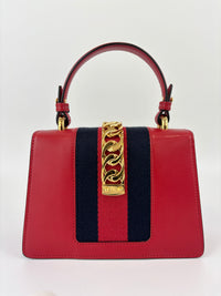 Gucci Sylvie Mini Leather Top Handle Crossbody Bag in Hibiscus Red - Glampot