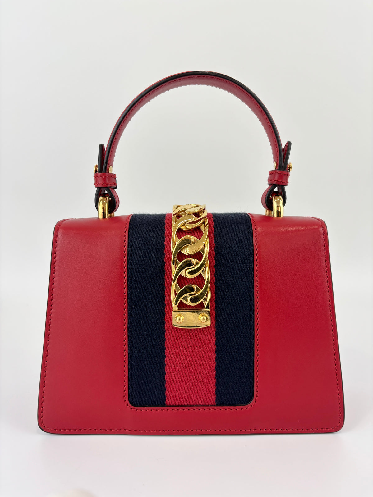 Gucci Sylvie Mini Leather Top Handle Crossbody Bag in Hibiscus Red - Glampot