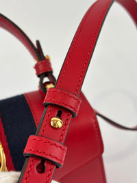 Gucci Sylvie Mini Leather Top Handle Crossbody Bag in Hibiscus Red - Glampot