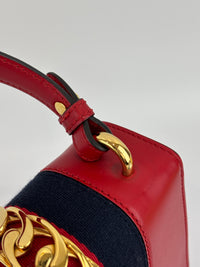 Gucci Sylvie Mini Leather Top Handle Crossbody Bag in Hibiscus Red - Glampot