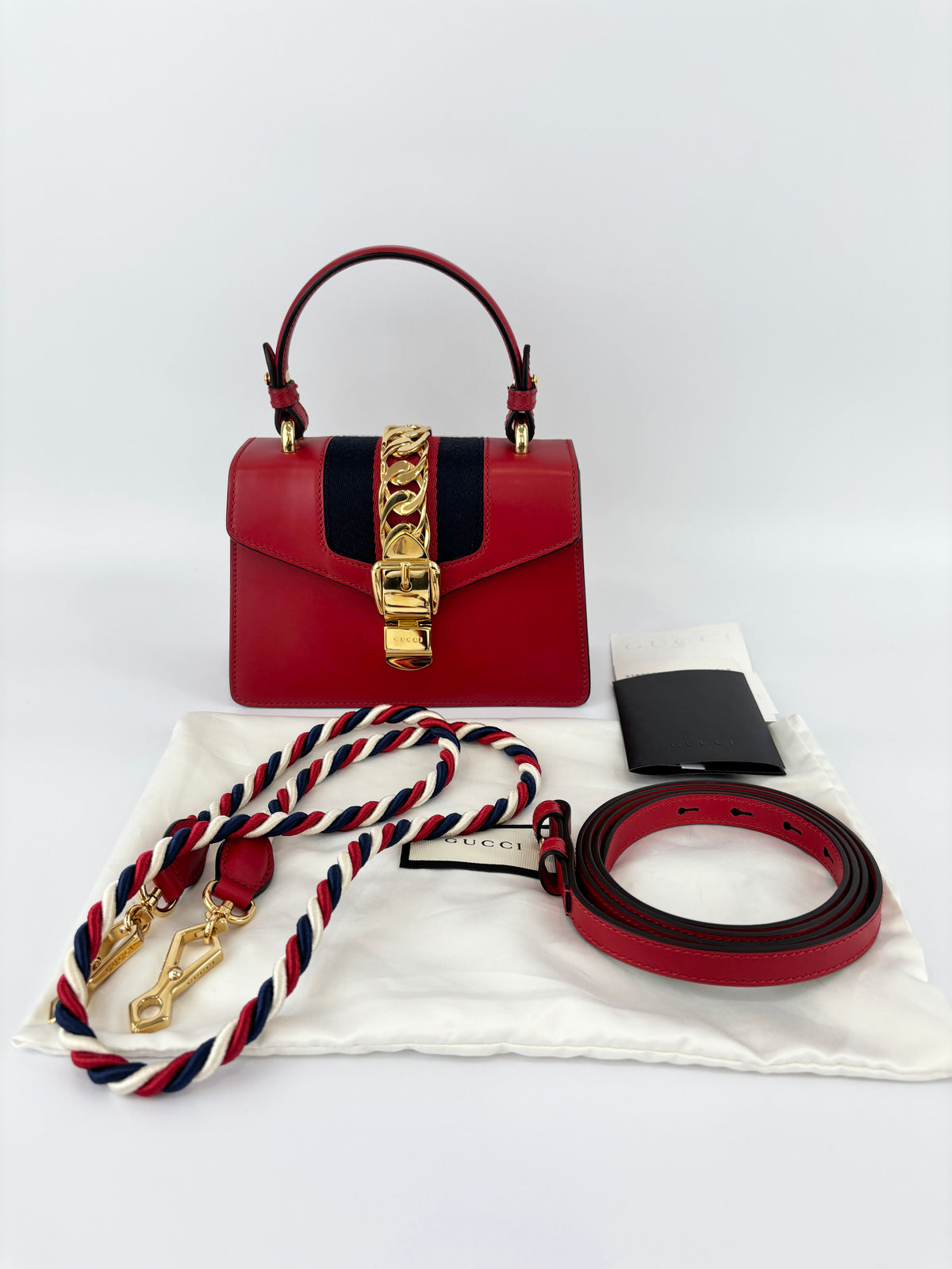 Gucci Sylvie Mini Leather Top Handle Crossbody Bag in Hibiscus Red - Glampot