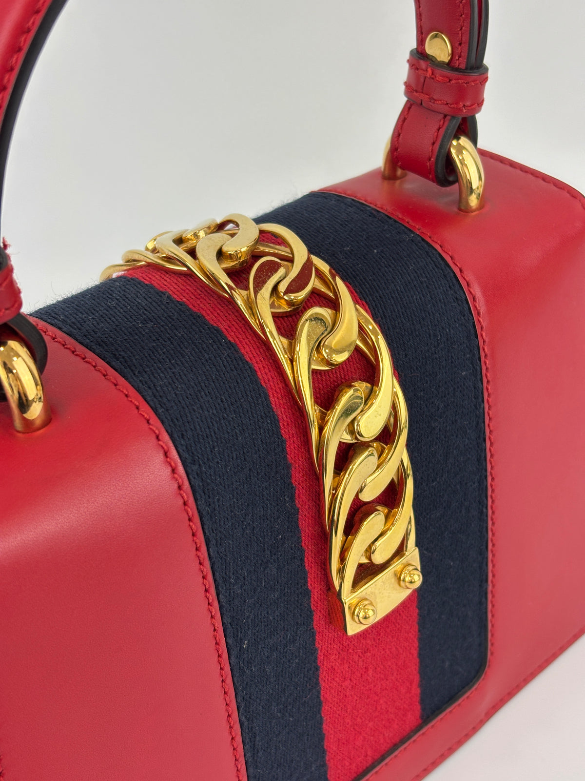 Gucci Sylvie Mini Leather Top Handle Crossbody Bag in Hibiscus Red - Glampot