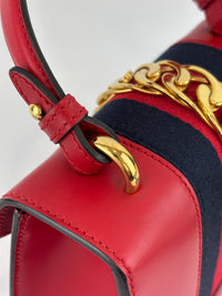 Gucci Sylvie Mini Leather Top Handle Crossbody Bag in Hibiscus Red - Glampot