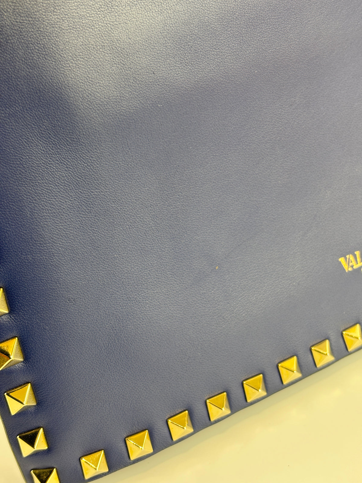 Valentino Garavani Rockstud Clutch in Navy - Glampot