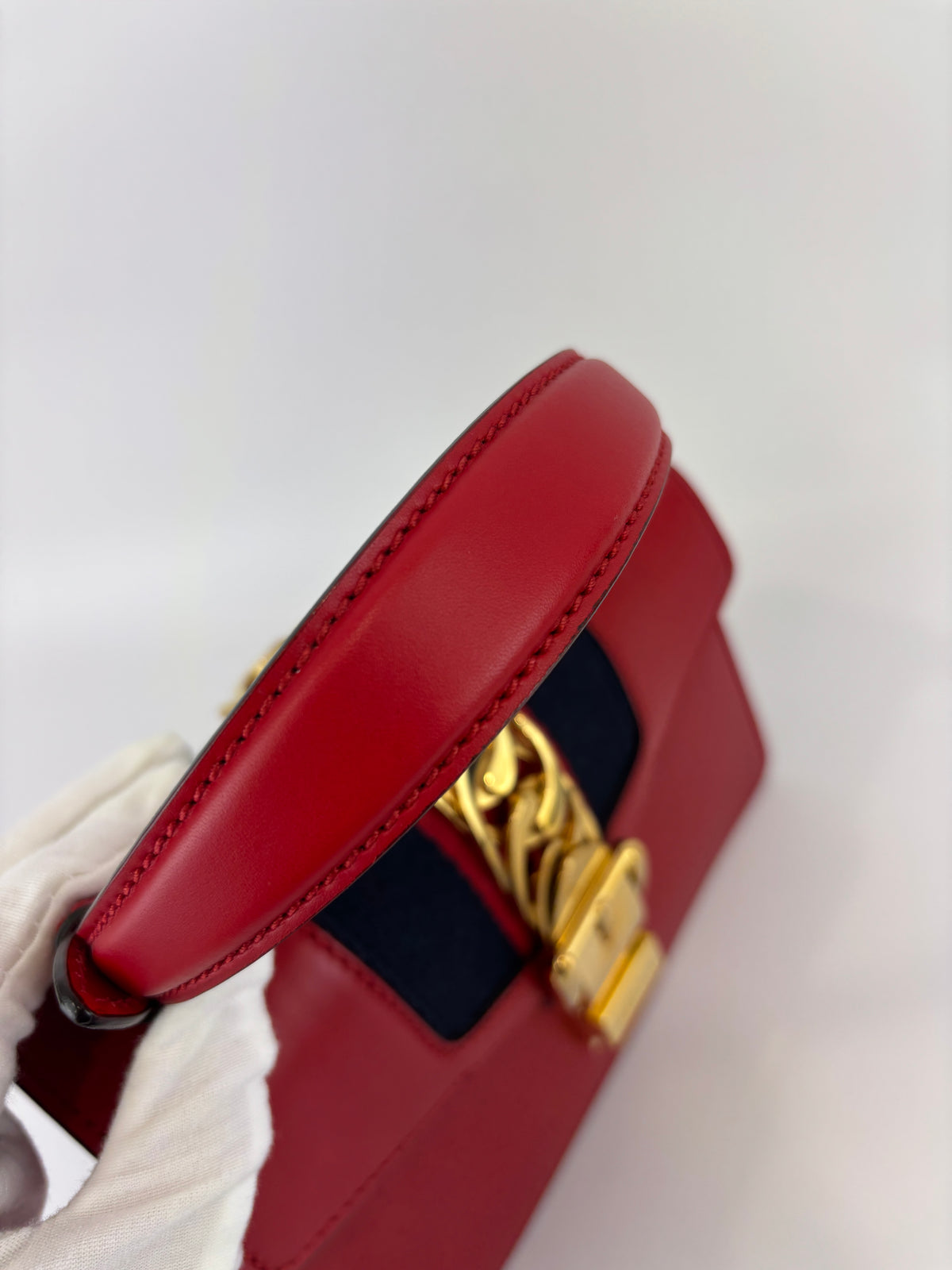 Gucci Sylvie Mini Leather Top Handle Crossbody Bag in Hibiscus Red - Glampot