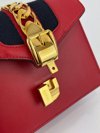 Gucci Sylvie Mini Leather Top Handle Crossbody Bag in Hibiscus Red - Glampot